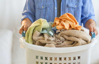 Man Holding Laundry Basket - Washmen.jpg__PID:c5c7f96b-3b61-46e8-bb11-076638f982d9